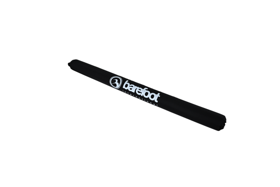 Side view of the Cable Protector & Shock Tube, showcasing its cylindrical shape with a black exterior and white branding.