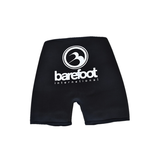 Back view of Iron Shorts, black neoprene with a white Barefoot International logo on the front.