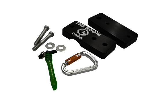Angled view of the 3" Boom Clamp set with black clamp pieces, silver hardware, green pin, and a silver carabiner.