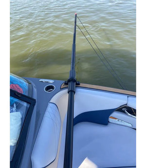 Deluxe Gunnel Mount Boom extended over the water from the side of a boat.