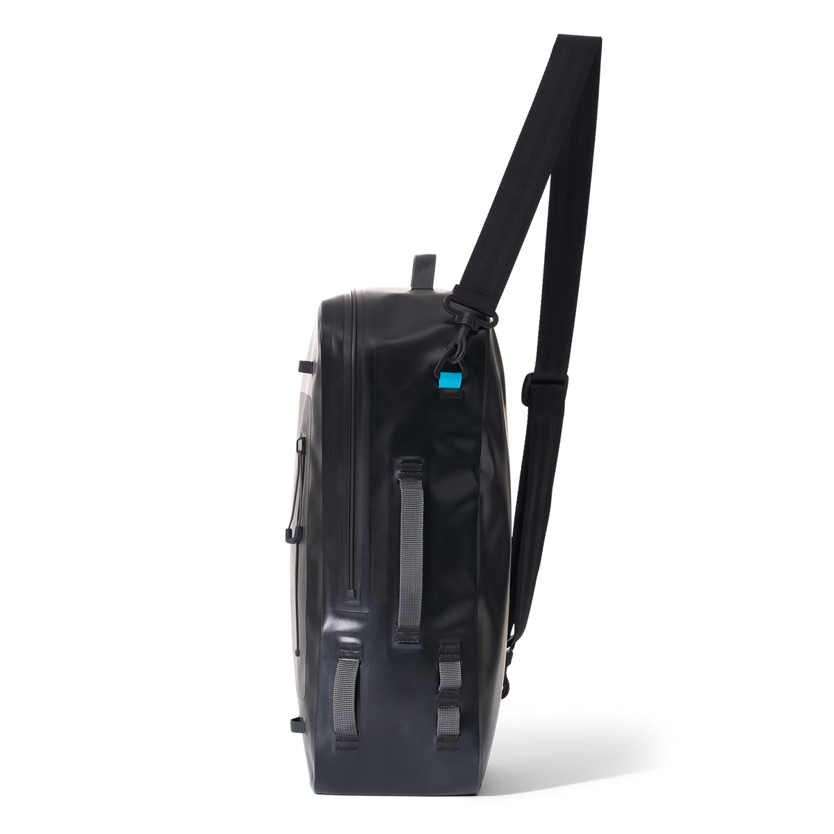 Side view of Day Pack showing slim profile, side straps, and waterproof zipper.
