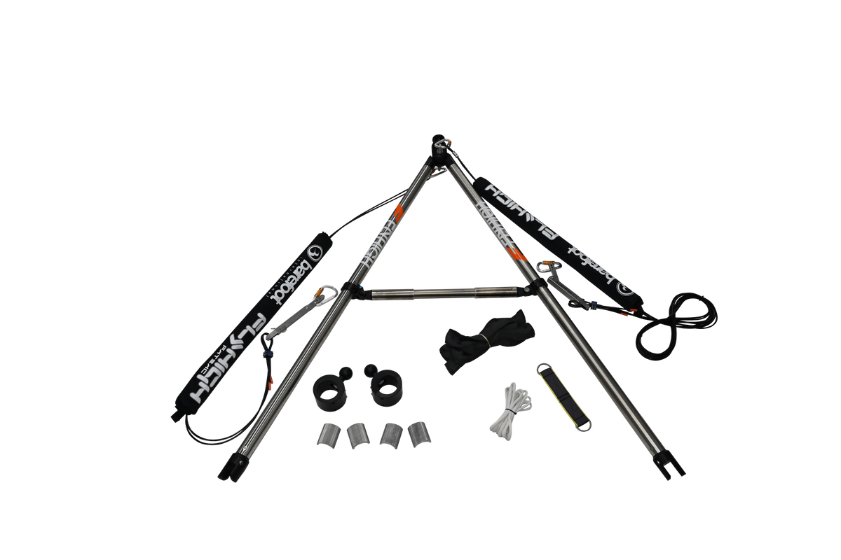 Disassembled Pro X Series Tower Extension with stainless steel poles, clamps, padding, and hardware laid out.