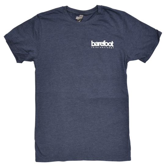 Barefoot Logo Tee in navy blue with a small white Barefoot International logo on the left chest.