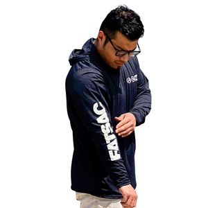 Man adjusting the sleeve of a black UV Protection Sun Shirt, showcasing the white "FATSAC" logo printed down the arm.