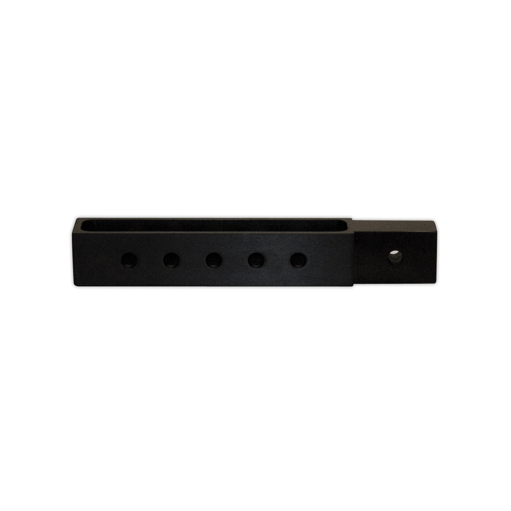 Close-up of a black rectangular boom height adjuster with multiple holes for adjustable positioning.